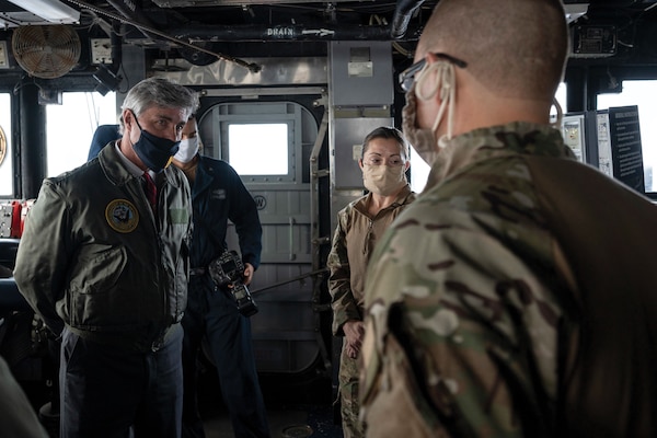 Members of USS Normandy visit, board, search, and seizure team brief Navy Secretary Kenneth Braithwaite on seizure of illicit shipment of advanced weapons and weapon components
intended for Houthis in Yemen, February 9, 2020 (U.S. Navy/Alexander C. Kubitza)