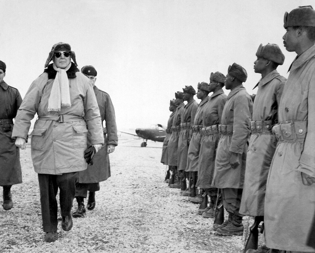 General of the Army Douglas MacArthur inspects troops of 24th Infantry on his arrival at Kimpo Airfield