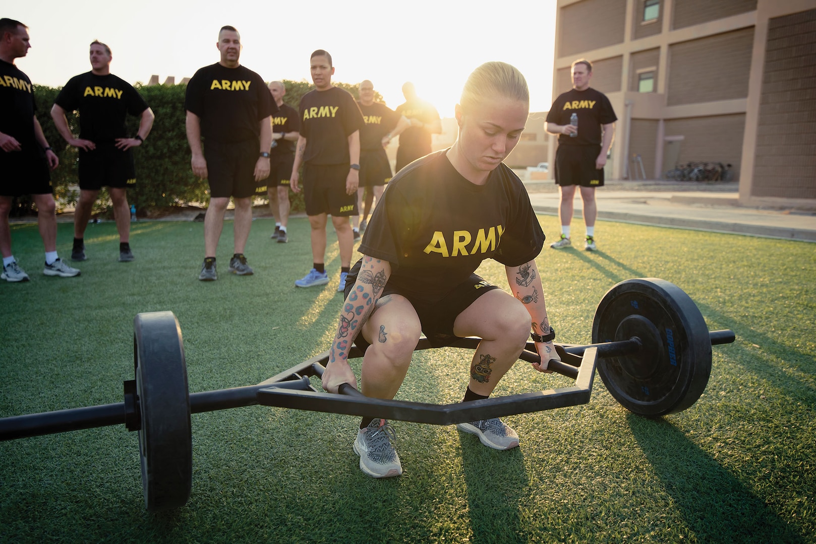 Sergeant Brittany Deturo, 401st Army Field Support Brigade, positions herself to practice deadlift element of new Army Combat Fitness Test