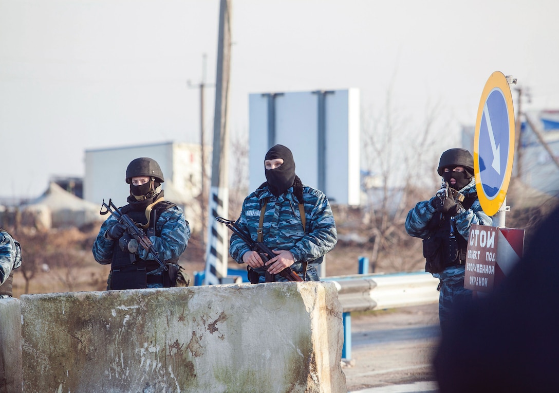 Berkut (Ukrainian riot police) man checkpoint at entrance to Crimean Peninsula