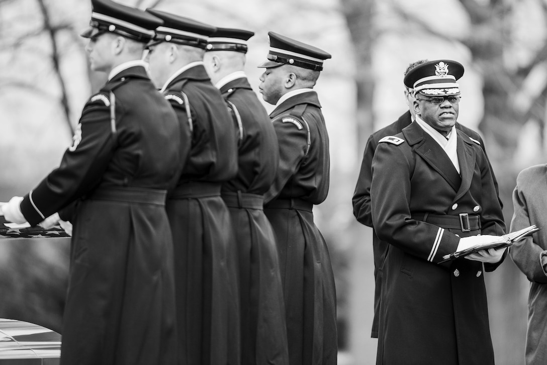 Soldiers from 3rd U.S. Infantry Regiment and Chaplain (Lieutenant Colonel) Sid Taylor, USA, help conduct funeral honors with escort for U.S. Army Air Forces Captain Lawrence Dickson