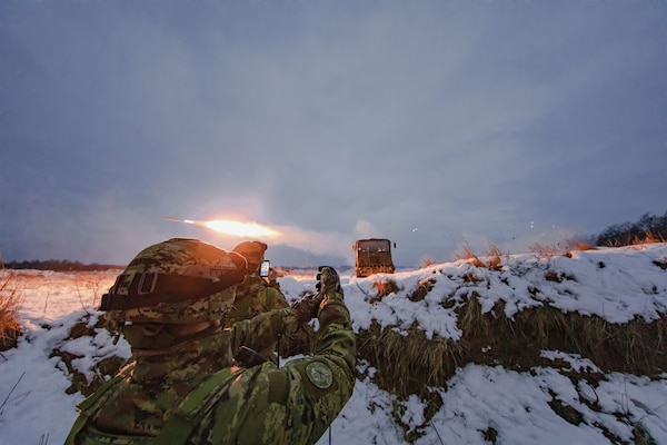 Croatian soldier assigned to Battle Group Poland presses remote trigger to Vulcan M-92 rocket launcher, firing barrage of missiles in support of Operation Raider Thunder, at Bemowo Piskie Training Area, Poland, February 6, 2019 (U.S. Army/Sarah Kirby)