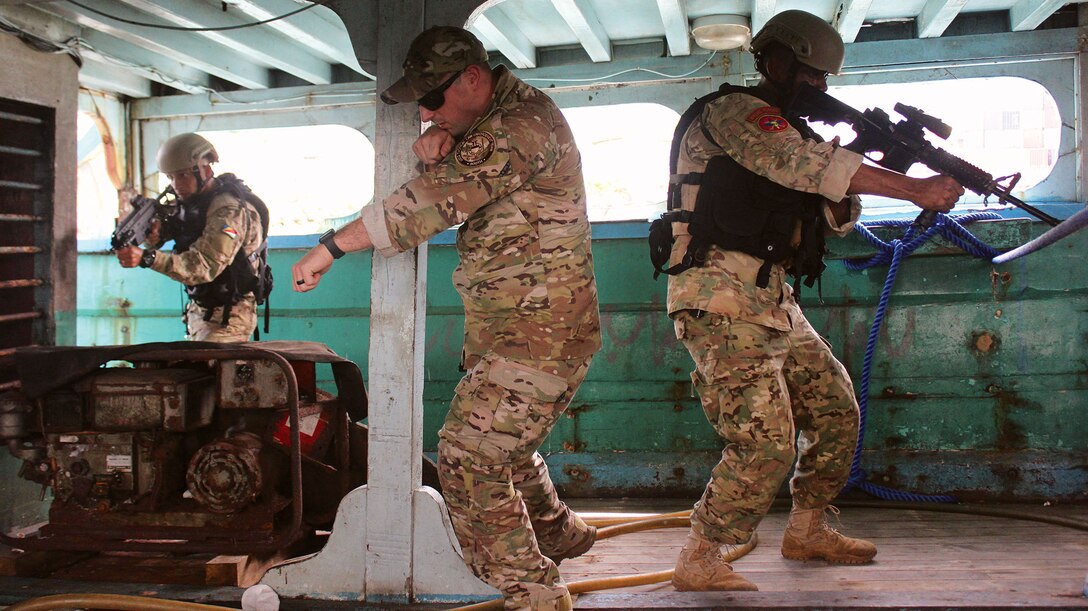 Seychelles coastguardsmen simulate boarding vessel