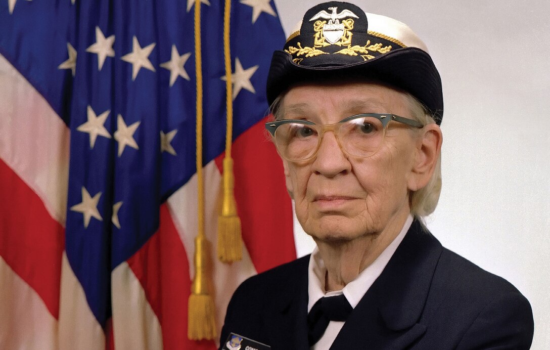 Commodore Grace M. Hopper, USN (covered), popularized idea of machine-independent programming languages that led to
development of COBOL