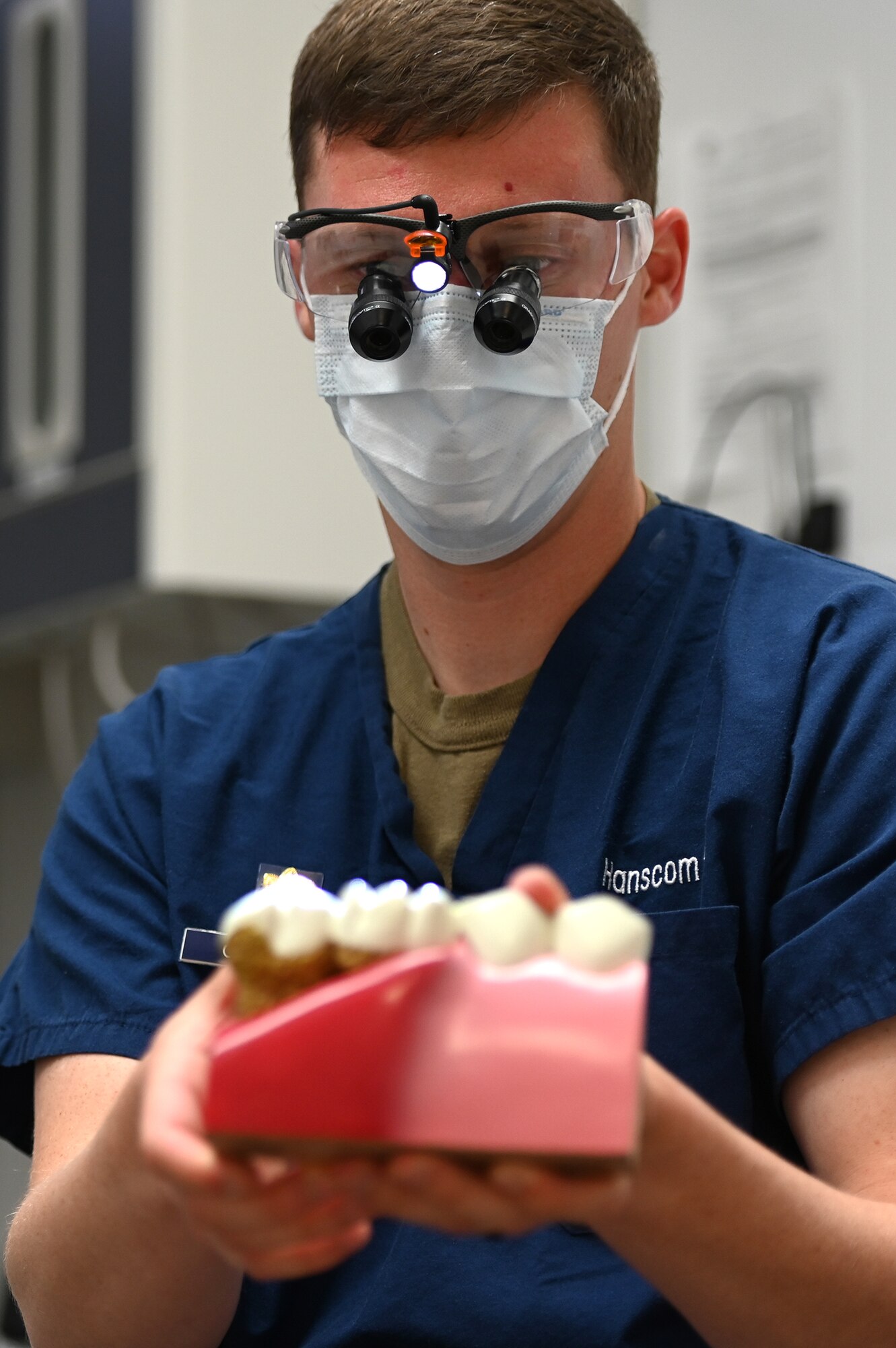 Maj. Thomas O’Connor, 66th Medical Squadron dental operations flight chief, poses for a photo holding a dental model in the medical clinic Nov. 13. O’Connor was recently selected for the Graduate Dental Education program and will attend a periodontics residency at Joint Base San Antonio-Lackland in 2020. (U.S. Air Force photo by Mark Herlihy)
