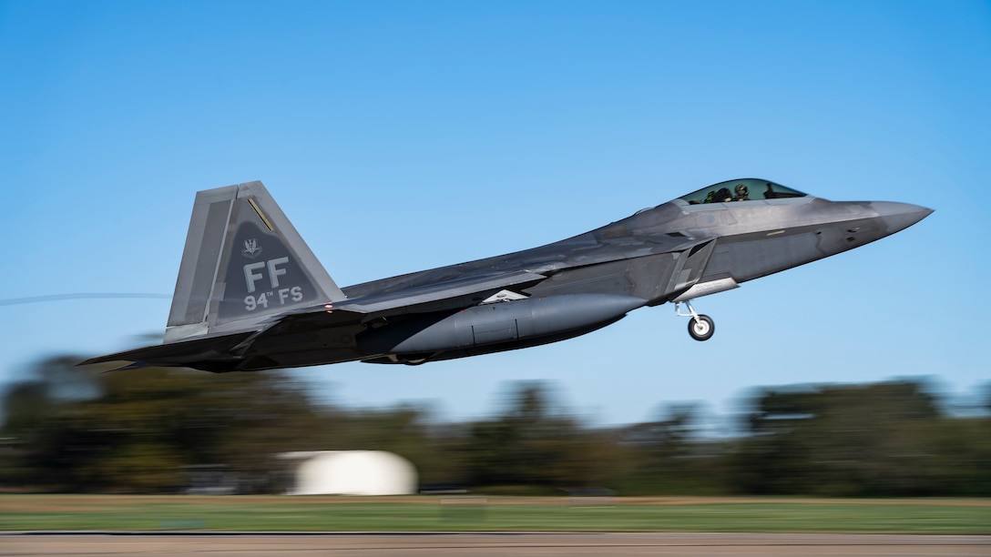 A U.S. Air Force F-22 Raptor aircraft assigned to the 1st Fighter Wing takes flight.
