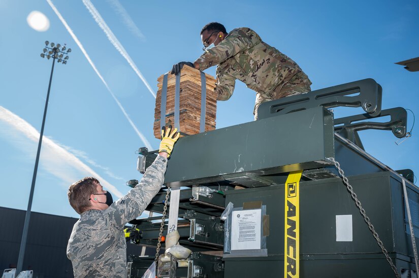 U.S. Air Force Airmen from the 633rd Logistics Readiness Squadron move cargo.