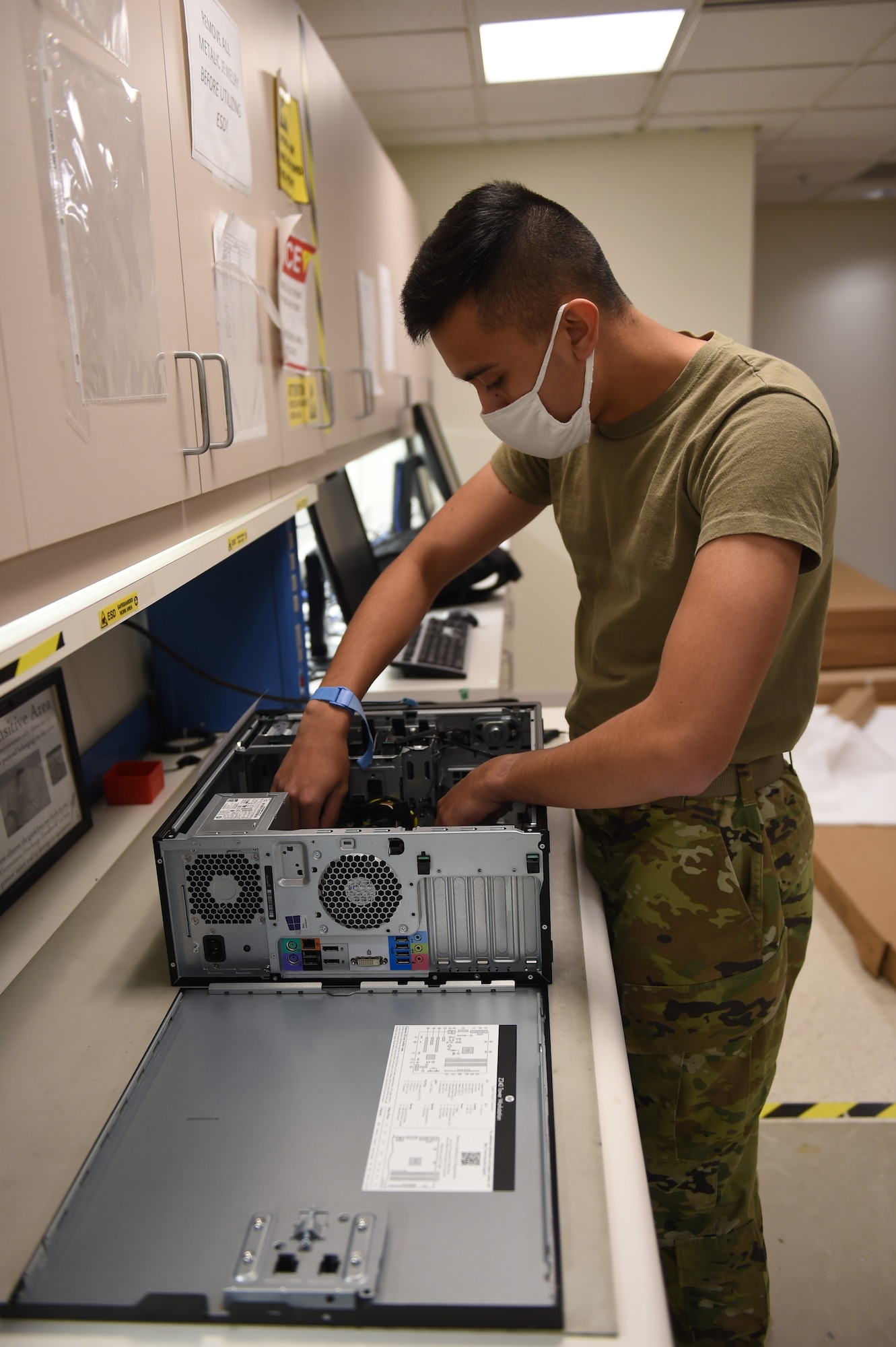 Airman Daniel Artrip, 627th Communications Squadron client systems technician, disassembles a computer on Joint Base Lewis-McChord, Wash., Oct. 22, 2020. The 627th CS is responsible for Team McChord’s internet network systems. (U.S. Air Force photo by Airman 1st Class Mikayla Heineck)