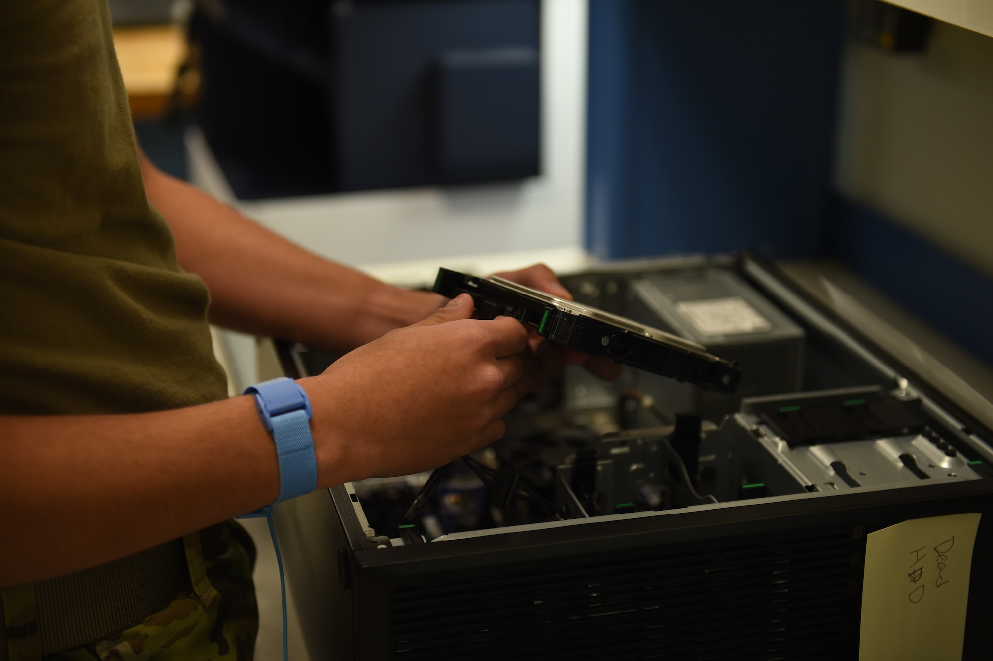 Airman Daniel Artrip, 627th Communications Squadron client systems technician, examines a hard drive in a broken computer on Joint Base Lewis-McChord, Wash., Oct. 22, 2020. Client systems technicians troubleshoot computer issues for different units across the base. (U.S. Air Force photo by Airman 1st Class Mikayla Heineck)