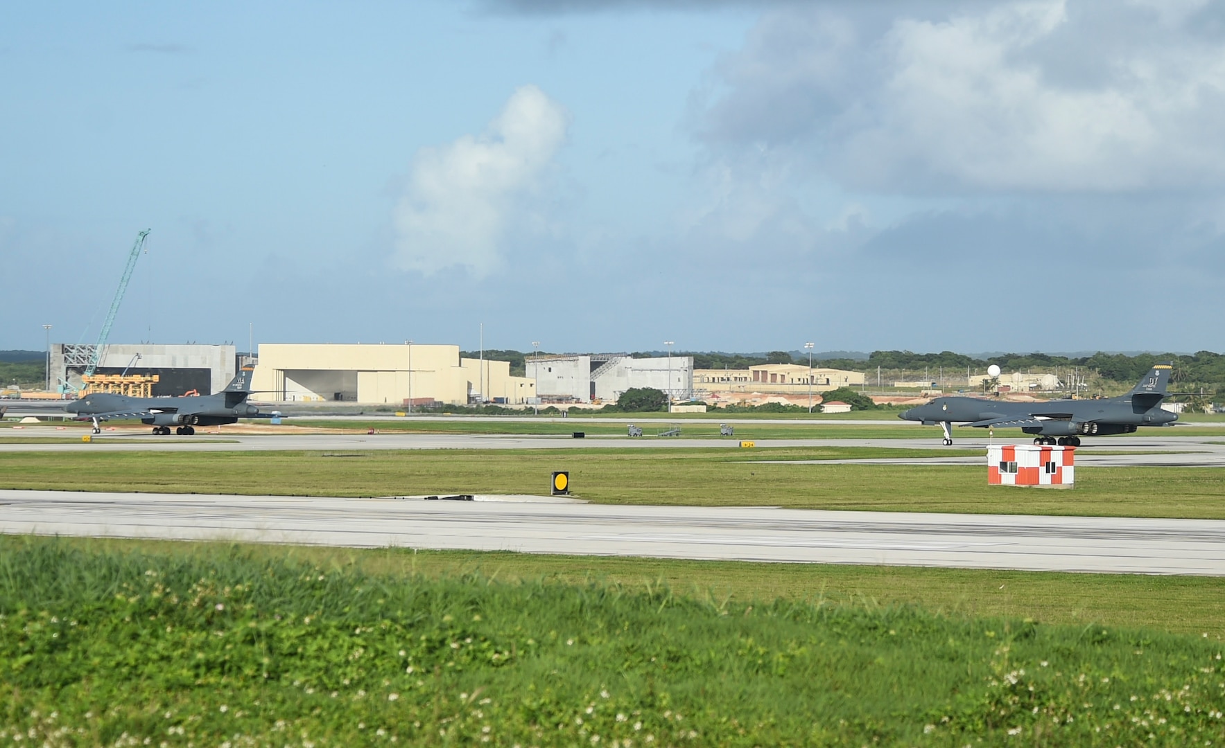 Two U.S. Air Force B-1B Lancers with the 9th Expeditionary Bomb Squadron taxi on a runway during a joint interoperability exercise at Andersen Air Force Base, Guam, Nov. 13, 2020. U.S. Air Force B-1B Lancers from the continental U.S. flew alongside the aircraft with the 9th EBS to demonstrate the bomber aircraft’s global reach and long-range strike capabilities as they trained in the Indo-Pacific region. (U.S. Air Force photo by Staff Sgt. David Owsianka)