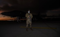 The U.S. Air Force security forces officer in-charge with the 9th Expeditionary Bomb Squadron stands near a U.S. Air Force B-1B Lancer on the flightline at Andersen Air Force Base, Guam, Nov. 13, 2020. Security forces personnel provided constant security for the aircraft during the Bomber Task Force deployment. (U.S. Air Force photo by Staff Sgt. David Owsianka)