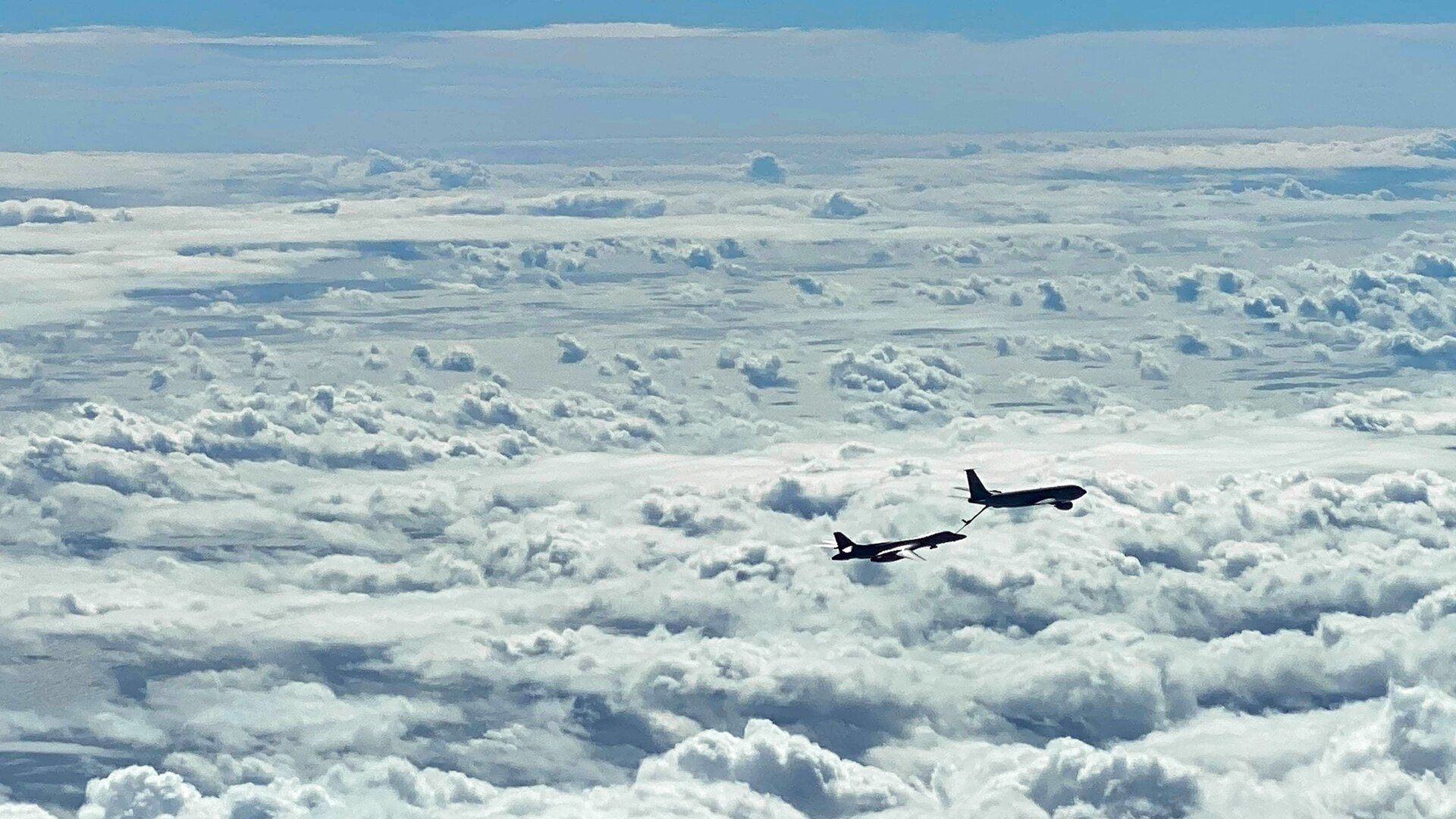 A U.S. Air Force B-1B Lancer and a 909th Aerial Refueling Squadron KC-135 Stratotanker, assigned to Kadena Air Base, Japan, conduct aerial refueling operations during a Bomber Task Force mission, Nov. 13, 2020, over the Pacific Ocean. Bomber Task Force deployments demonstrate U.S. commitment to allies and partners and they train regularly with other units throughout the theater in order to maintain a free and open Indo-Pacific. (U.S. Air Force courtesy photo by 909th Aerial Refueling Squadron)