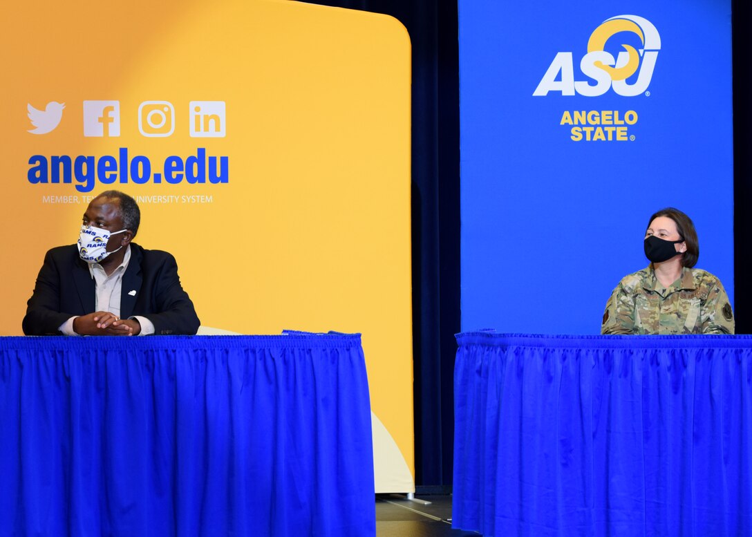 Angelo State University President, Lt. Gen. (Ret), Ronnie D. Hawkins Jr. and U.S. Air Force Col. Angelina Maguinness, 17th Training Group commander, listen to the dean of the College of Education, Dr. Scarlet Clouse discuss the Memorandum of Understanding between ASU and Goodfellow Air Force Base during the transfer agreement signing at the Houston Harte University Center, Nov. 13, 2020. The MOU allowed all enlisted personnel with Community College of the Air Force transcripts to enroll into ASU’s Bachelor of Applied Arts and Sciences degree program. (U.S. Air Force photo by Airman 1st Class Ethan Sherwood)