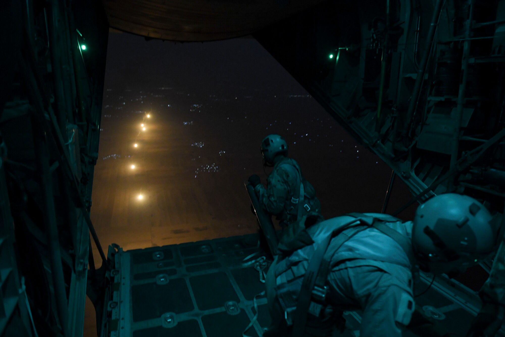 U.S. Air Force Airmen drop illumination flares from a C-130 Hercules Oct. 30, 2020.