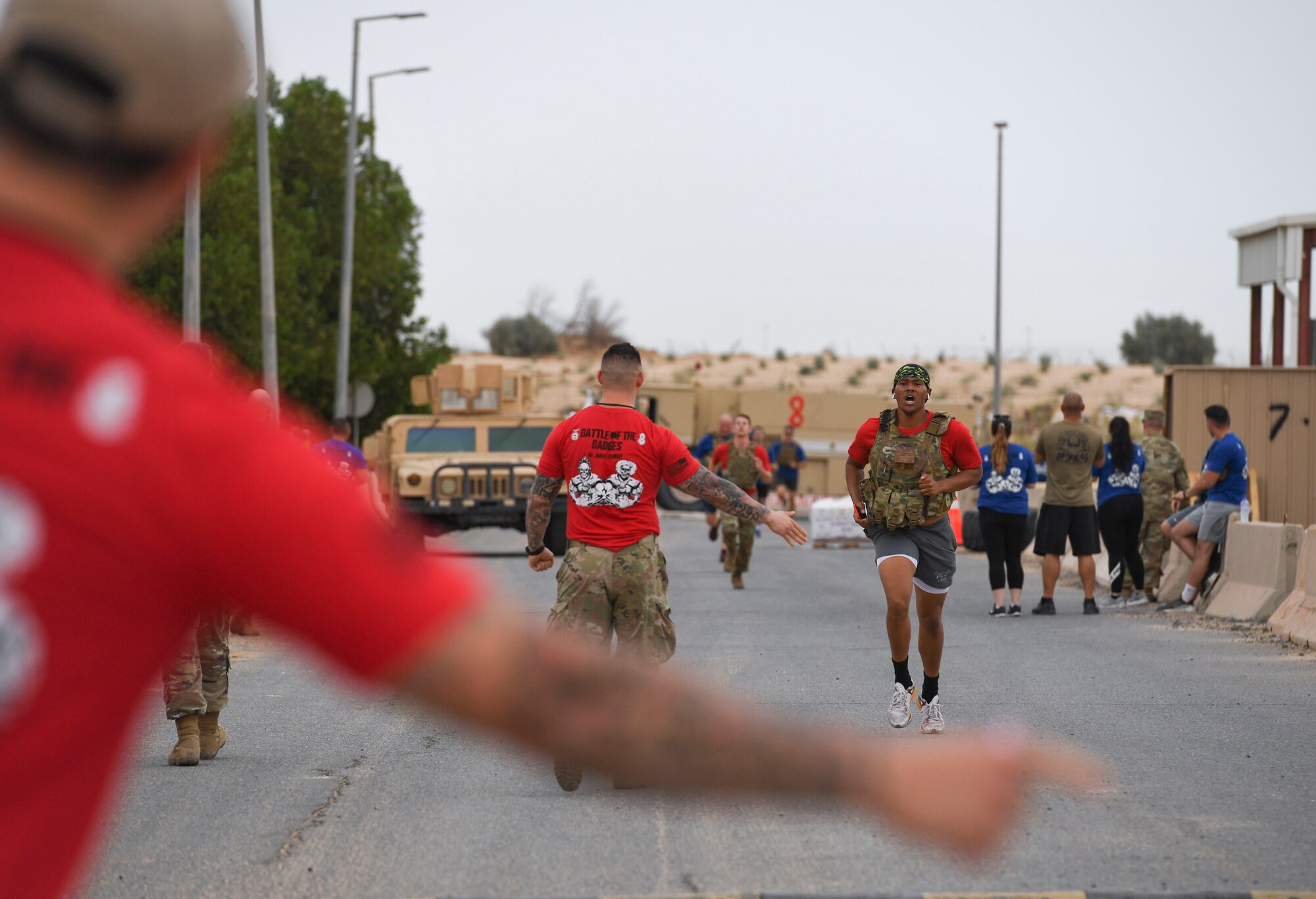 U.S. Air Force Senior Airman Donavan Shepard, 407th Expeditionary Civil Engineer Squadron fire protection specialist, runs toward the finish line during the Battle of the Badges event at Ahmed Al Jaber Air Base, Kuwait, Nov. 11, 2020.