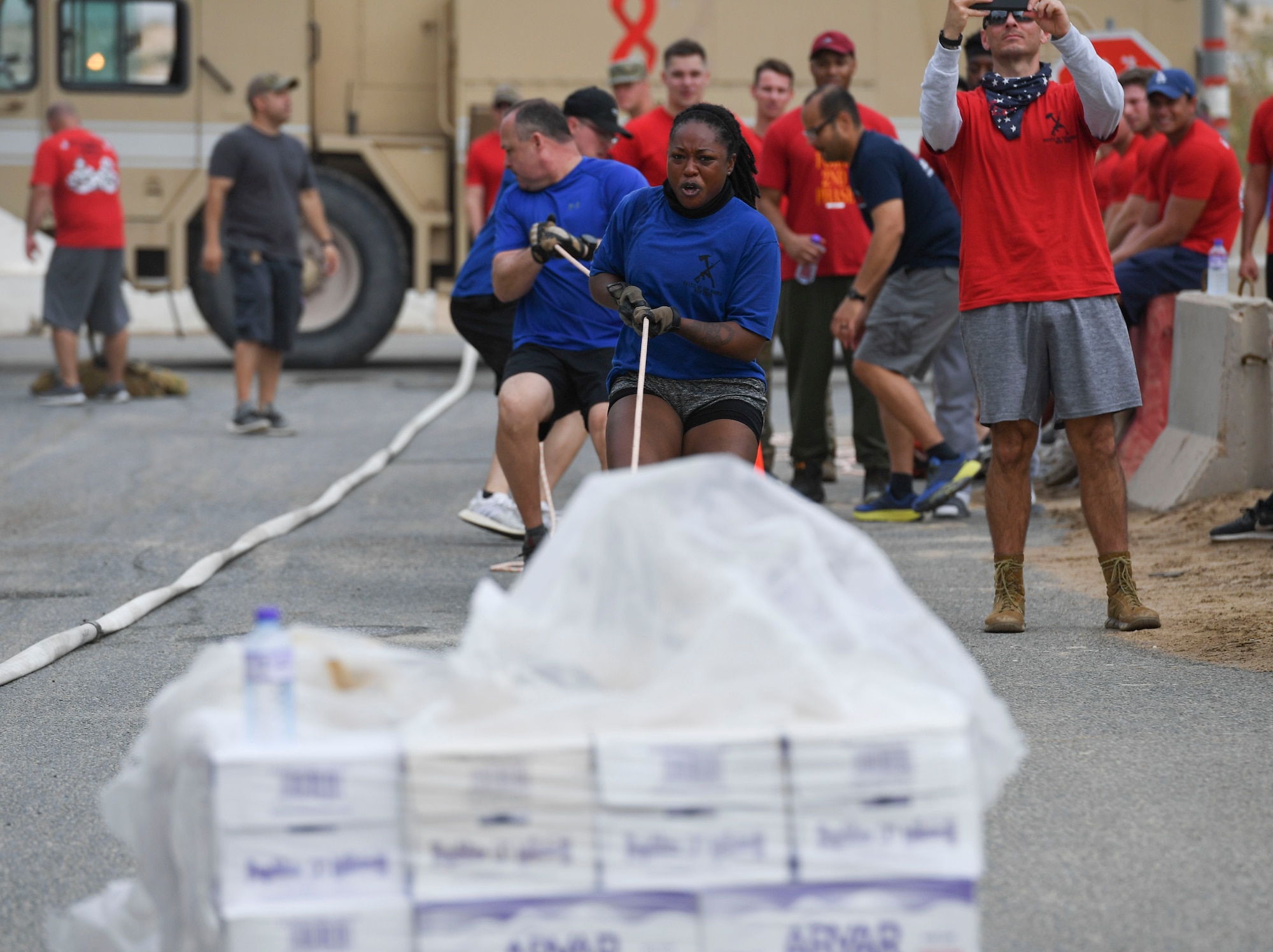 U.S. Air Force Airmen assigned to the 407th Expeditionary Security Forces Squadron pull a pallet of water during the Battle of the Badges event at Ahmed Al Jaber Air Base, Kuwait, Nov. 11, 2020.