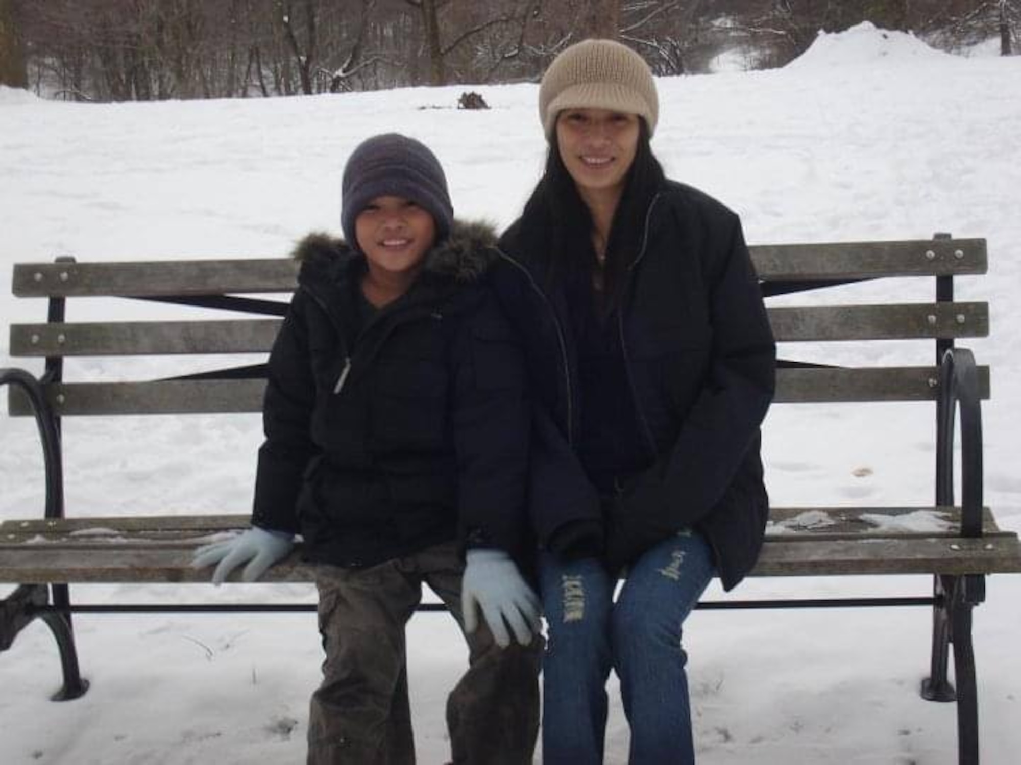 two people sit on a bench