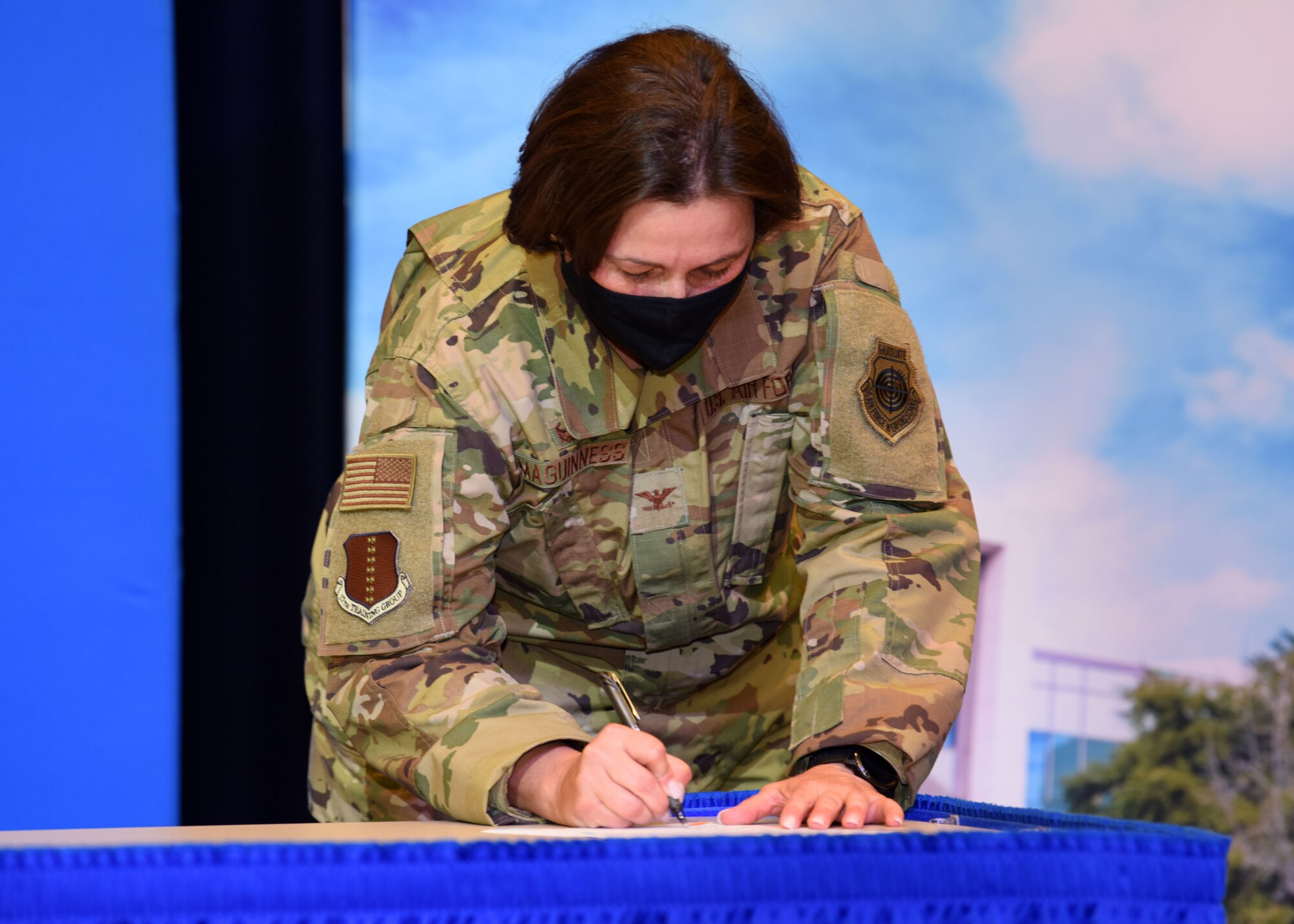 U.S. Air Force Col. Angelina Maguinness, 17th Training Group commander, signs the Memorandum of Understanding between Angelo State University and Goodfellow Air Force Base during the transfer agreement signing at the Houston Harte University Center, Nov. 13, 2020. Maguinness’ team worked the agreement with ASU over the course of five years. (U.S. Air Force photo by Airman 1st Class Ethan Sherwood)