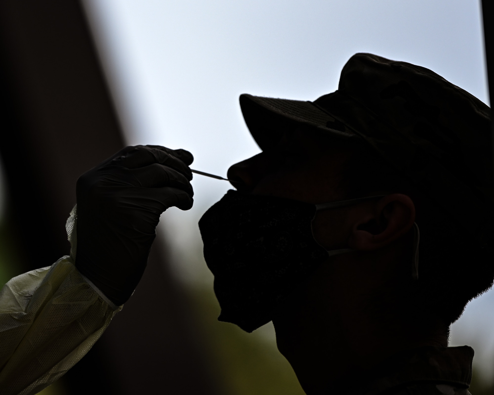 A U.S. Air Force Airman receives a nasal swab during pre-deployment COVID testing.