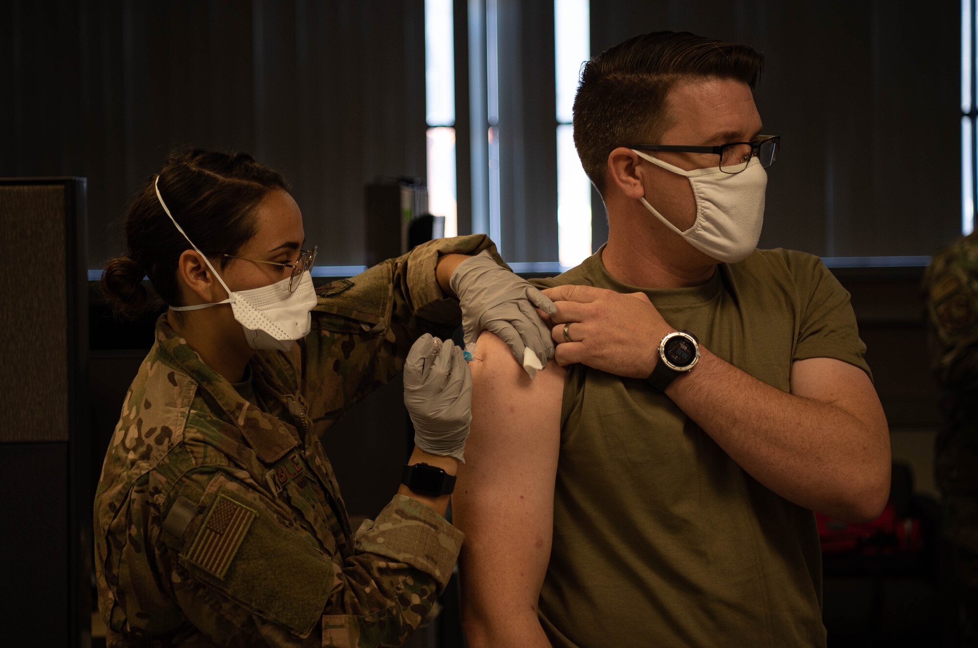 A member of the 1st Fighter Wing receives an immunization during out processing.