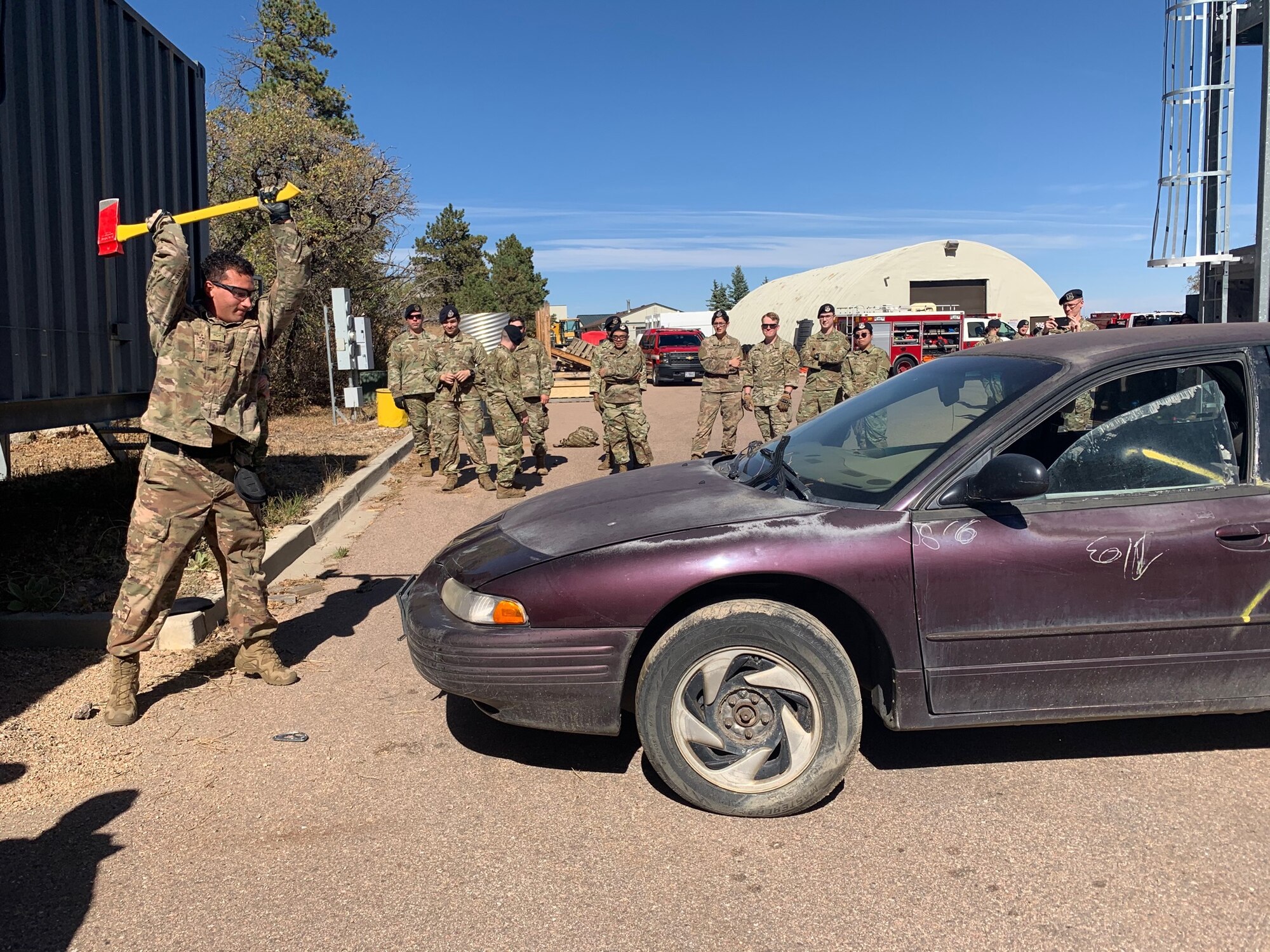 Security Forces members practice breaching methods on a car