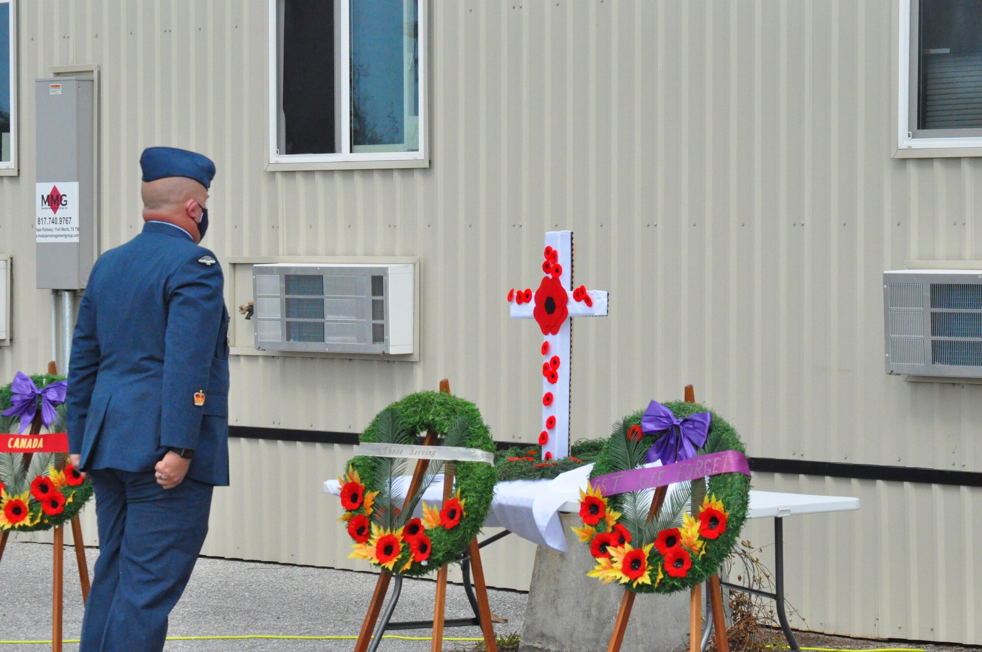 Warrant Officer Donnie Smith, at attention in front of the Cenotaph, paying his respects