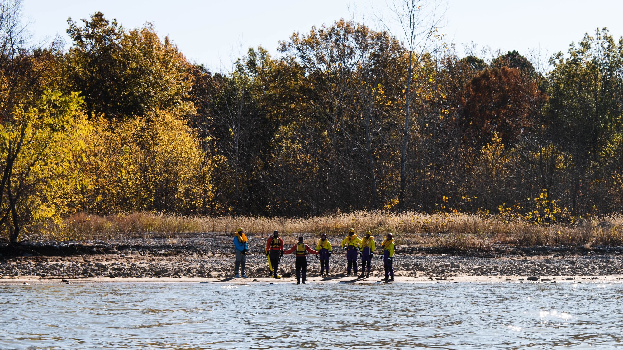 Men on a shore line