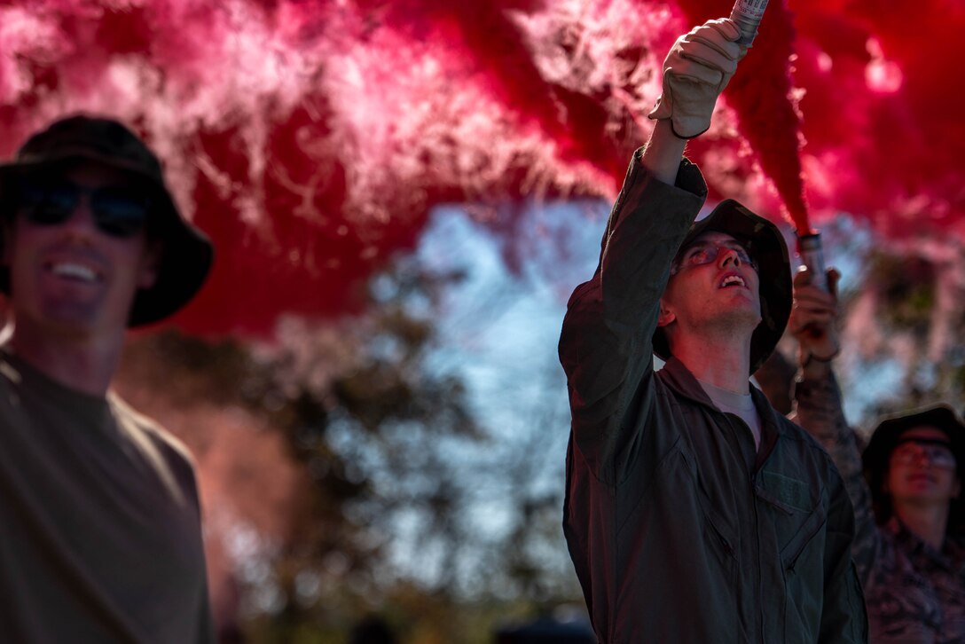 Airmen lighting flares