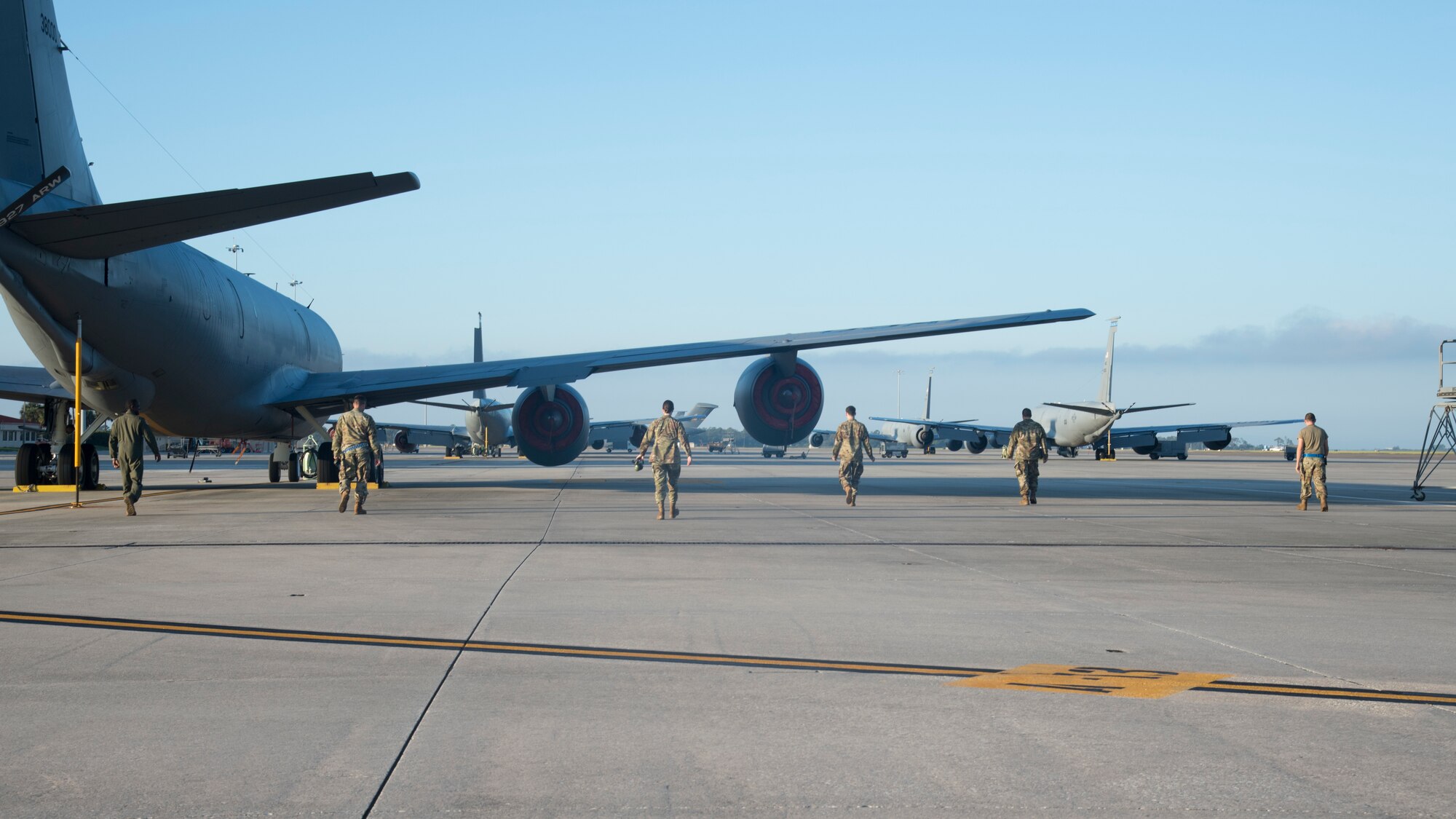Team MacDill Airmen conduct a foreign object and debris (FOD) walk on the flight line at MacDill Air Force Base, Fla., Nov. 13, 2020, following Tropical Storm Eta.