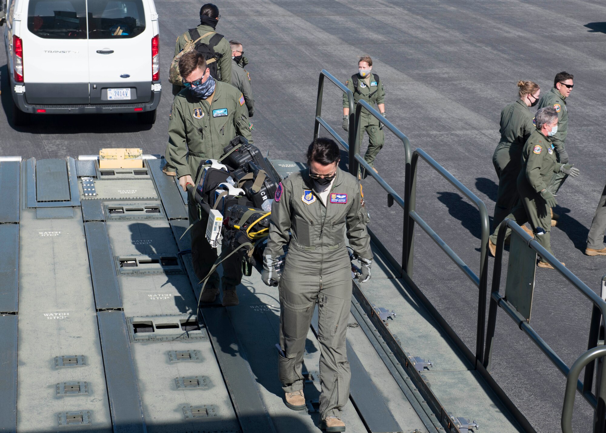 U.S. Air Force Capt. Amanda Scanlon, 18th Aeromedical Evacuation Squadron flight nurse, and U.S. Air National Guard Tech. Sgt. Alex Klinger, 187th AES aeromedical evacuation technician, loaded a litter of AE supplies on a KC-135 Stratotanker at Joint Base Pearl Harbor-Hickam, Hawaii, Nov. 10, 2020. By working with Pacific Air Force and Total Force partners from the 187th AES and 18th AES, Team Fairchild Airmen were able to ensure a continued investment in a high quality of life and medical service for Airmen and joint partners in the Pacific. (U.S. Air Force photo by Senior Airman Lawrence Sena)