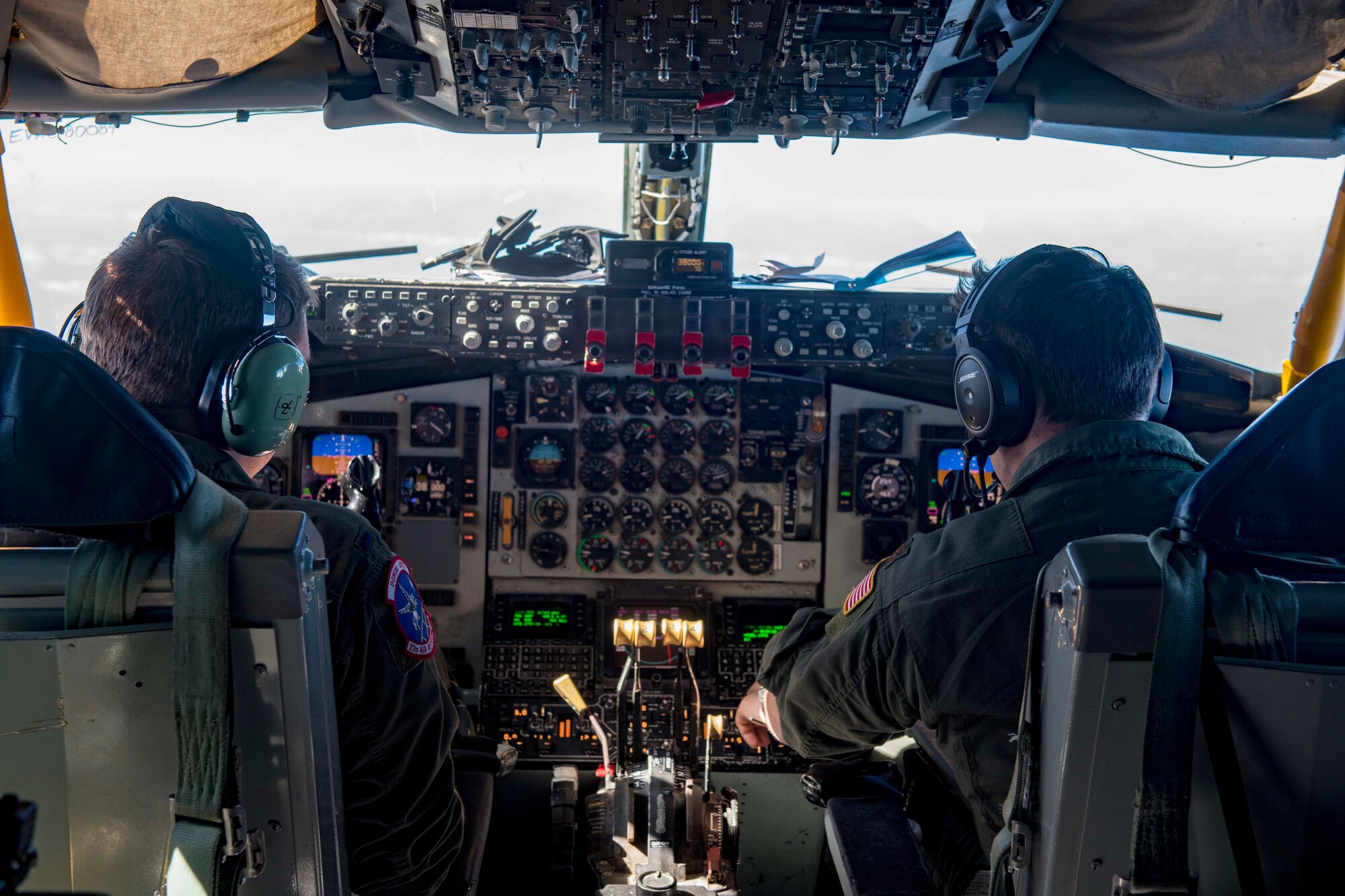 U.S. Air Force 1st Lt. Jake Erickson (left) and Maj. Frank Simon (right), 93rd Air Refueling Squadron KC-135 Stratotanker pilots, operate a KC-135 en route to conduct an aeromedical evacuation in Japan, Nov. 10, 2020. Aeromedical evacuation missions consist of critical care transport teams executing patient movement and care using mobility aircraft such as the C-17 Globemaster III, C-130 Hercules and KC-135. (U.S. Air Force photo by Senior Airman Lawrence Sena)