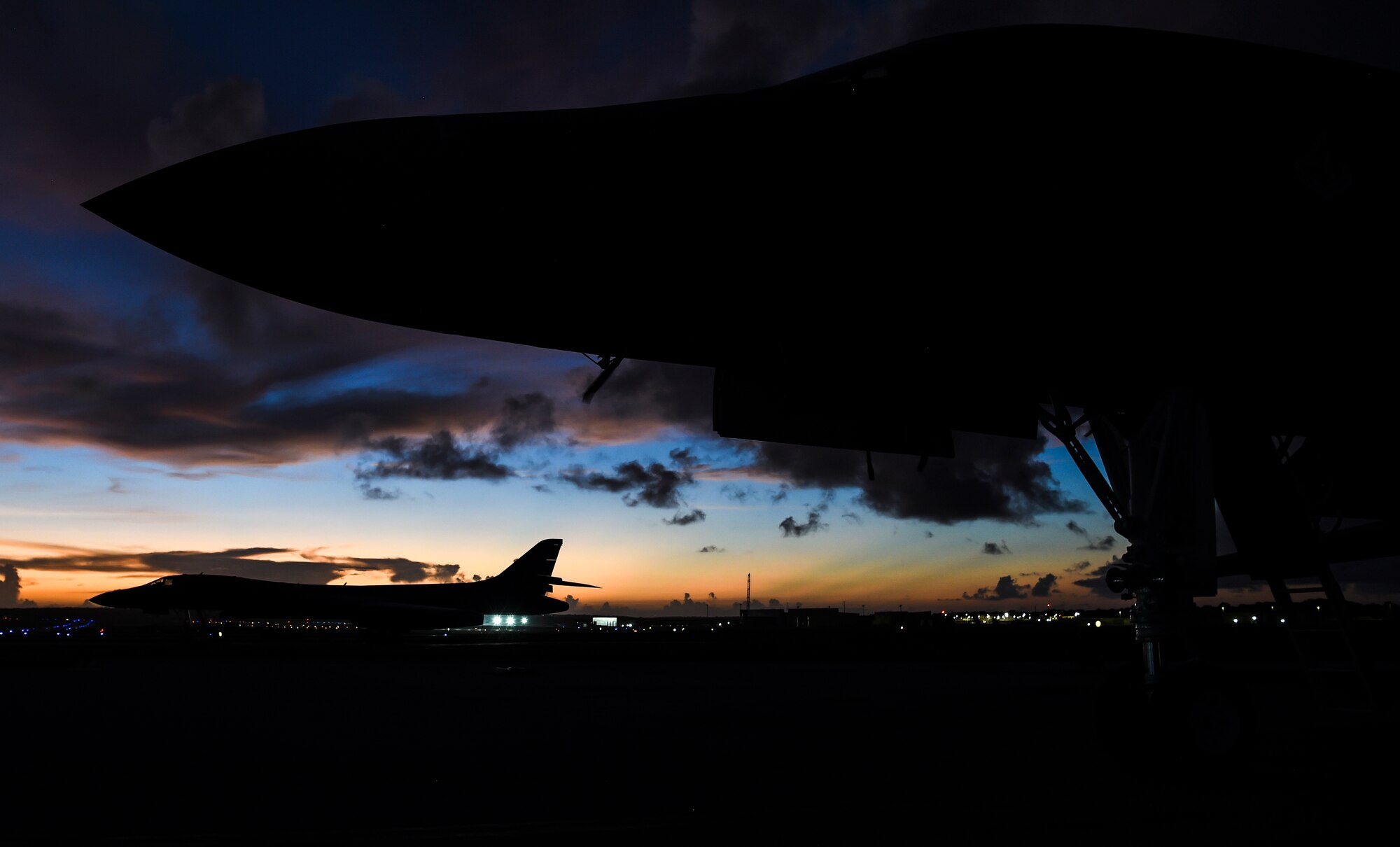 Two U.S. Air Force B-1B Lancers sit on the flightline after participating in a joint interoperability exercise at Andersen Air Force Base, Guam, Nov. 13, 2020. The exercise enabled the aircrew to test long-range force packaging and demonstrate global reach capabilities in the Indo-Pacific region. (U.S. Air Force photo by Staff Sgt. David Owsianka)