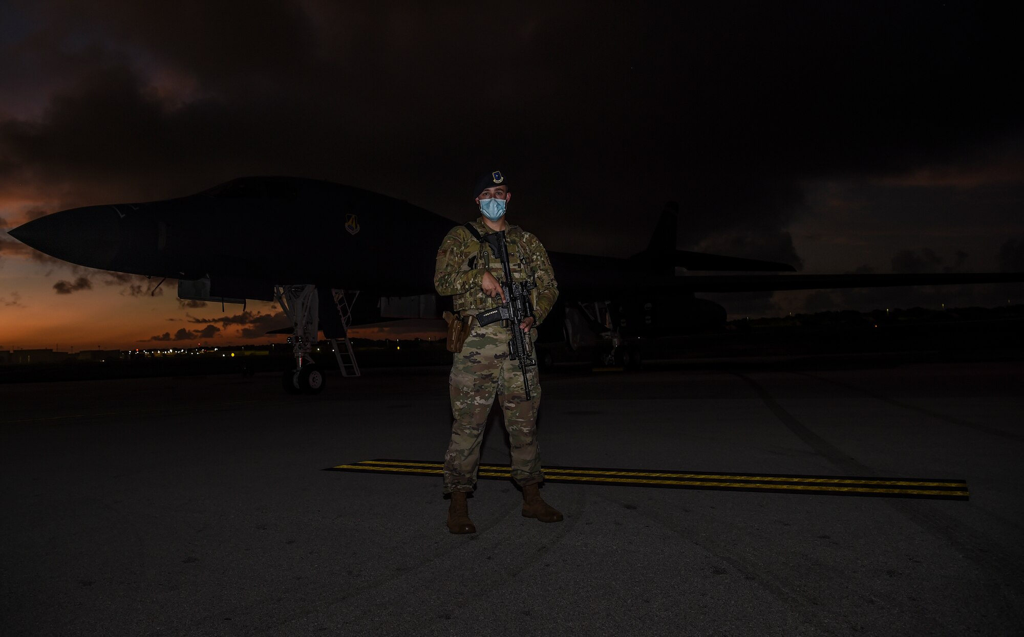 The U.S. Air Force security forces officer in-charge with the 9th Expeditionary Bomb Squadron stands near a U.S. Air Force B-1B Lancer on the flightline at Andersen Air Force Base, Guam, Nov. 13, 2020. Security forces personnel provided constant security for the aircraft during the Bomber Task Force deployment. (U.S. Air Force photo by Staff Sgt. David Owsianka)