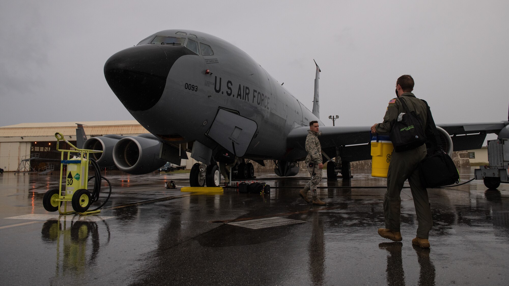 U.S. Air Force Airman 1st Class Travis Lee, 718th Aircraft Maintenance Squadron internal flight control systems journeyman, and Tech. Sgt. Michael Newman, 909th Aerial Refueling Squadron boom operator, prepare a KC-135 Stratotanker for a training sortie, Nov. 13, 2020, at Kadena Air Base, Japan. The 909th ARS conducted aerial refueling operations with B-1B Lancers in support of a Bomber Task Force deployment. (U.S. Air Force photo by Staff Sgt. Peter Reft)