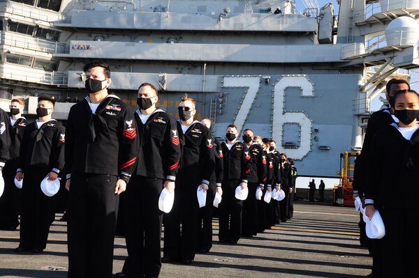 Sailors prepare to man the rails as the Navy’s only forward-deployed aircraft carrier, USS Ronald Reagan (CVN 76), returns to Yokosuka, Japan.