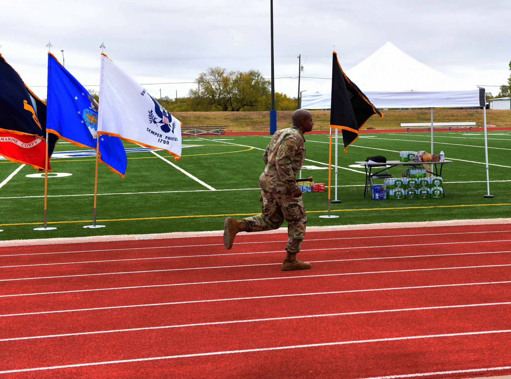 U.S. Air Force Col. James Finlayson, 17th Training Wing vice commander, begins the Prisoner of War and Missing in Action 24 hour remembrance run by making the first lap around the track with the baton. During the run the baton never stopped moving. (U.S. Air Force photo by Airman 1st Class Dominique Parham)
