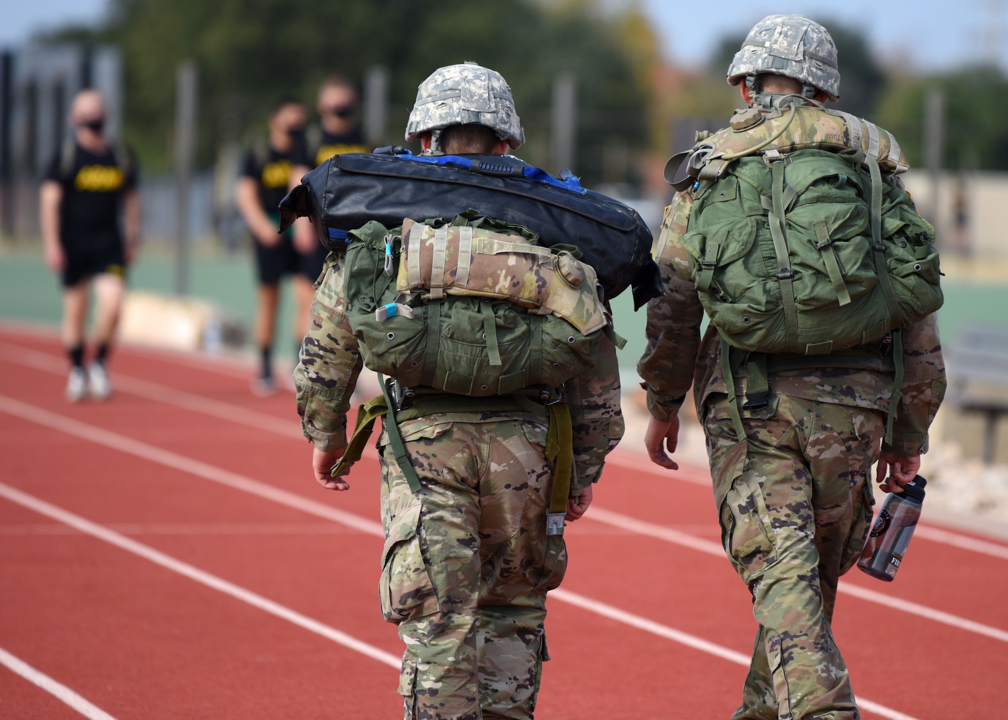 U.S. Army Soldiers ruck around the track during the Prisoner of War and Missing in Action 24 hour remembrance run at the Mathis Fitness Center track on Goodfellow Air Force Base, Texas, Nov. 14, 2020. One Soldier ran for 20 straight hours on his own during the event. (U.S. Air Force photo by Airman 1st Class Ethan Sherwood)