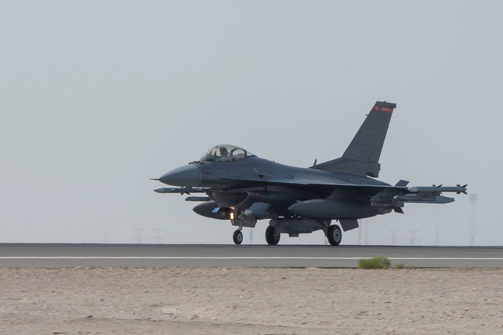 A U.S. Air Force F-16 Fighting Falcon assigned to the 480th Fighter Squadron taxis on the flightline upon arrival at Al Dhafra Air Base, United Arab Emirates, Nov. 12, 2020.