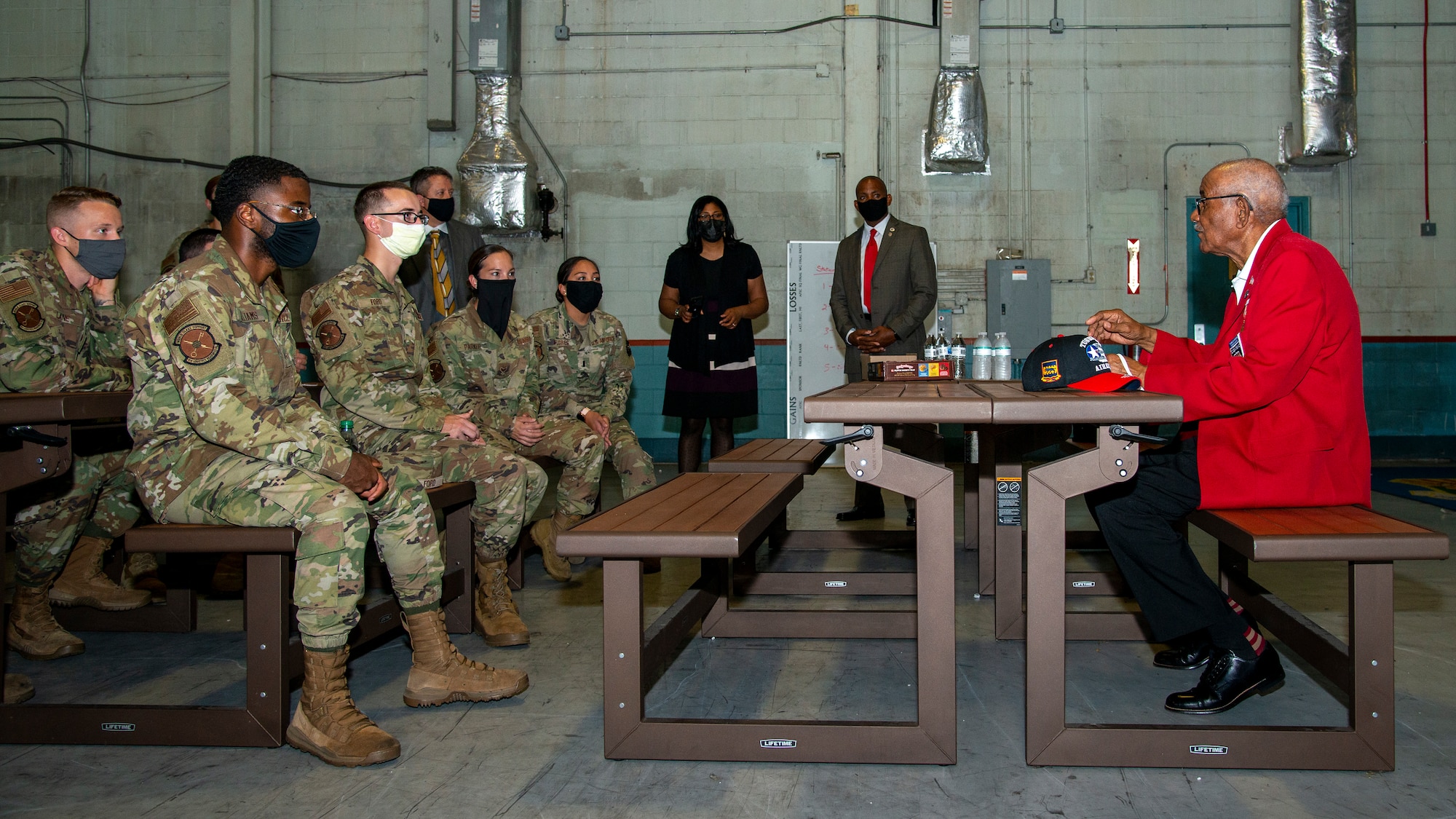 U.S. Army Air Forces Sgt. Thomas Newton, a Documented Original Tuskegee Airman, speaks to 6th Logistics Readiness Squadron Airmen at MacDill Air Force Base, Fla., Nov. 10, 2020.