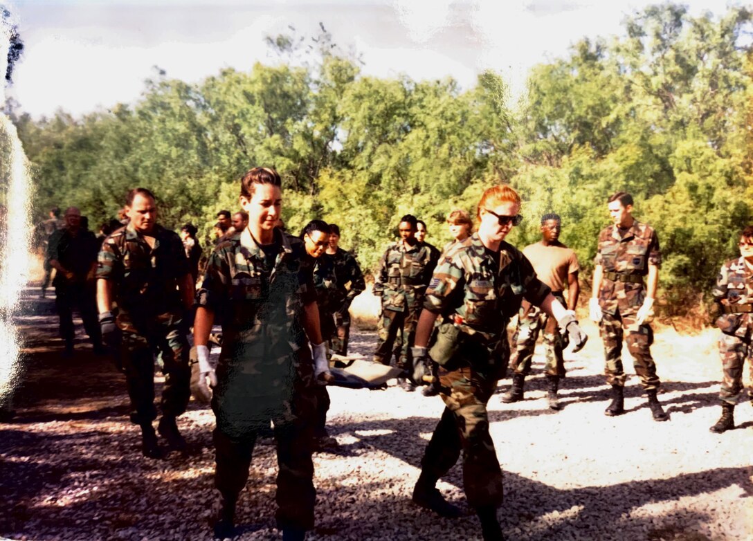 Tech. Sgt. Tammy Campbell (middle right), carries a litter with medical Airmen during Contingency Aeromedical Staging Facility training at Sheppard Air Force Base, Texas, circa 1997. (U.S. Air Force courtesy photo)