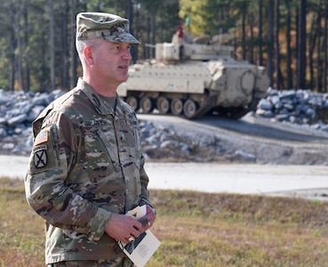 A Tennessee National Guard Bradley fighting vehicle sends rounds downrange during a re-opening ceremony for the Multi-Purpose Range Complex Nov. 6, 2020, at Maneuver Training Center Fort Pickett, Virginia.