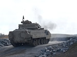 A Tennessee National Guard Bradley fighting vehicle sends rounds downrange during a re-opening ceremony for the Multi-Purpose Range Complex Nov. 6, 2020, at Maneuver Training Center Fort Pickett, Virginia.