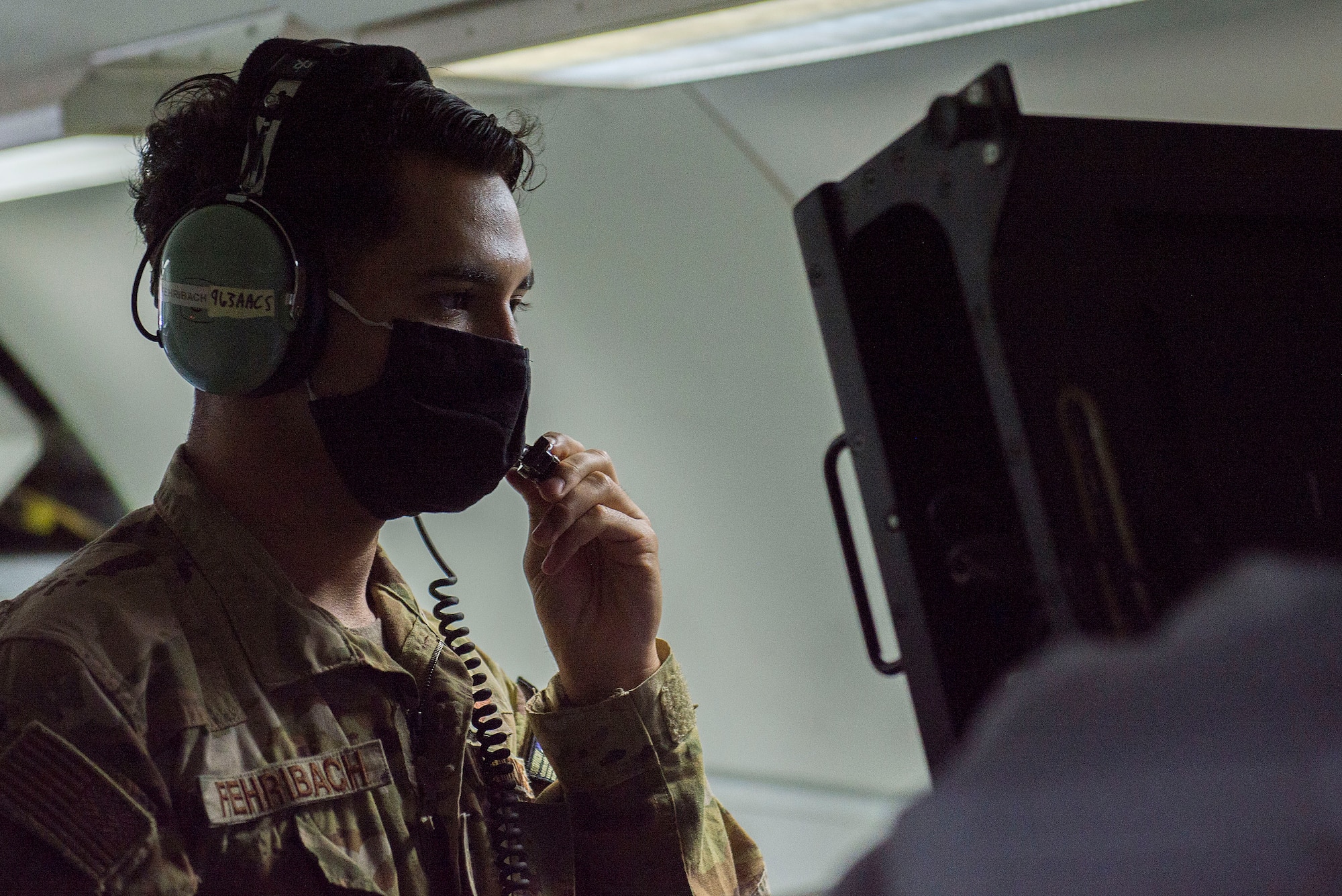 U.S. Air Force Senior Airman Dominic Fehribach, 968th Expeditionary Airborne Air Control Squadron mission systems operator, performs pre-flight procedures onboard an E-3G Sentry Airborne Warning and Control System at Al Dhafra Air Base, United Arab Emirates, Nov. 8, 2020.