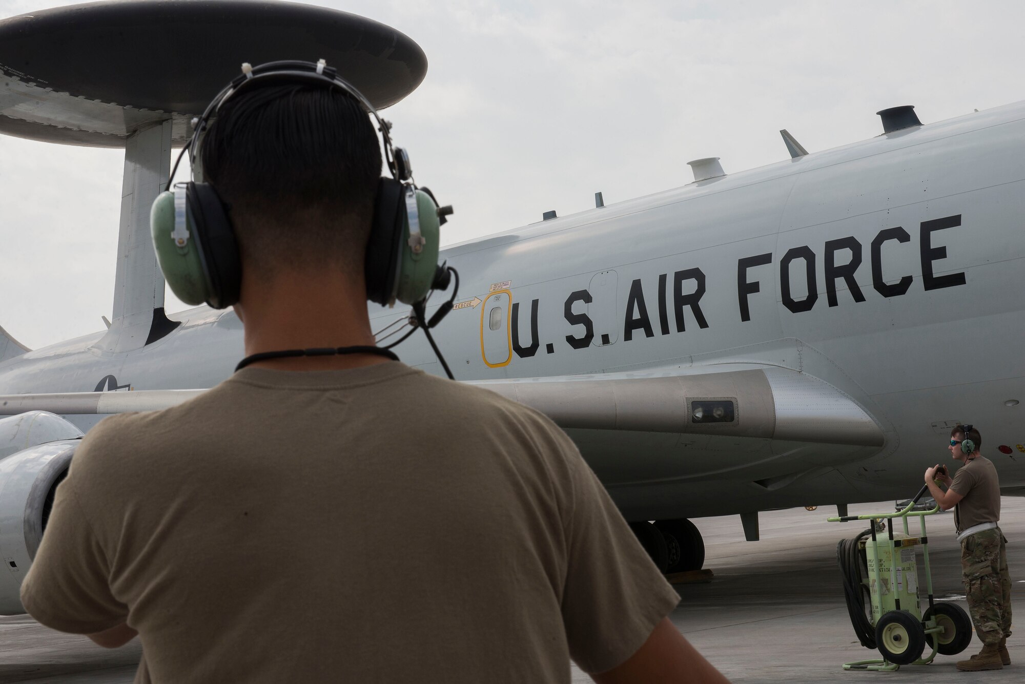 A U.S. Airman assigned to the 380th Expeditionary Aircraft Maintenance Squadron Sentry aircraft maintenance unit performs pre-flight procedures on an E-3G Sentry Airborne Warning and Control System at Al Dhafra Air Base, United Arab Emirates, Nov. 8, 2020.