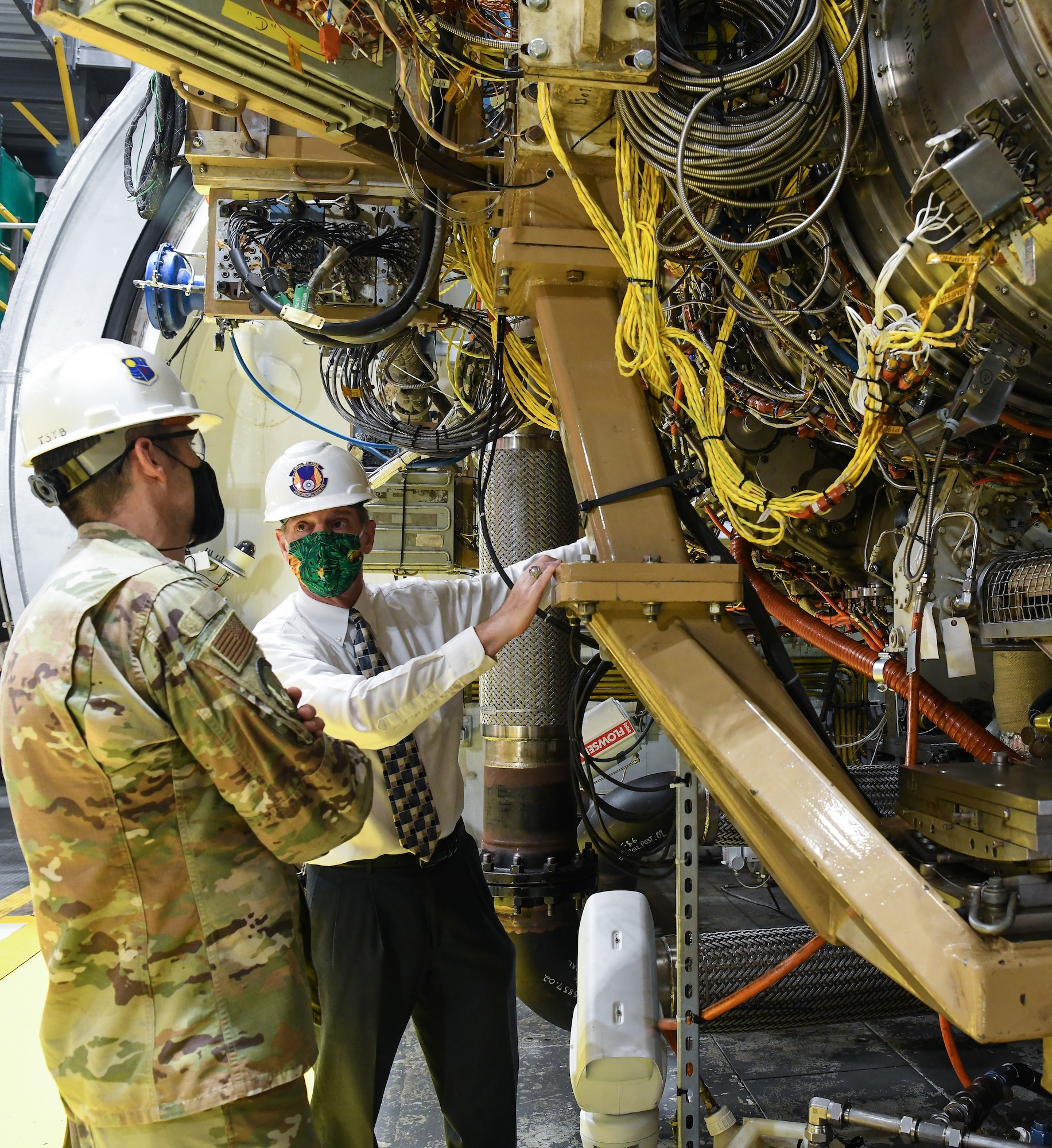 Jeff Albro, right, Joint Strike Fighter Joint Program Office F135 ground test and evaluation manager, speaks with Lt. Col. Lane Haubelt, Materiel leader for the Arnold Engineering Development Complex Aeropropulsion Ground Test Branch, as they and others tour the J2 test cell with an F135 engine installed, Sept. 2, 2020, at Arnold Air Force Base, Tenn. (U.S. Air Force photo by Jill Pickett)