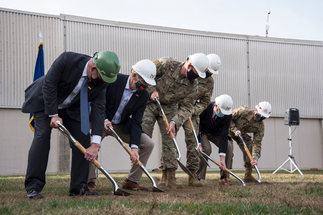 From left, Kevin Cozart, the senior vice president of Messer Construction Company; Sen. Rob Portman;  U.S. Air Force Col. Patrick Miller, the 88th Air Base Wing commander; U.S. Air Force Col. Maurizio Calabrese, the National Air and Space Intelligence Center commander; Rep. Mike Turner; and U.S. Army Col. Eric Crispino, the U.S. Army Corp of Engineers commander, Louisville District, turn dirt at the NASIC Intelligence Production Complex III groundbreaking event at Wright-Patterson Air Force Base, Ohio, Nov. 5, 2020. The new building will provide NASIC advanced lab capabilities for mission-specific functions, intelligence collection planning, modeling and simulation, and war-gaming. (U.S. Air Force photo by Tech. Sgt. Nathan L. Maysonet)