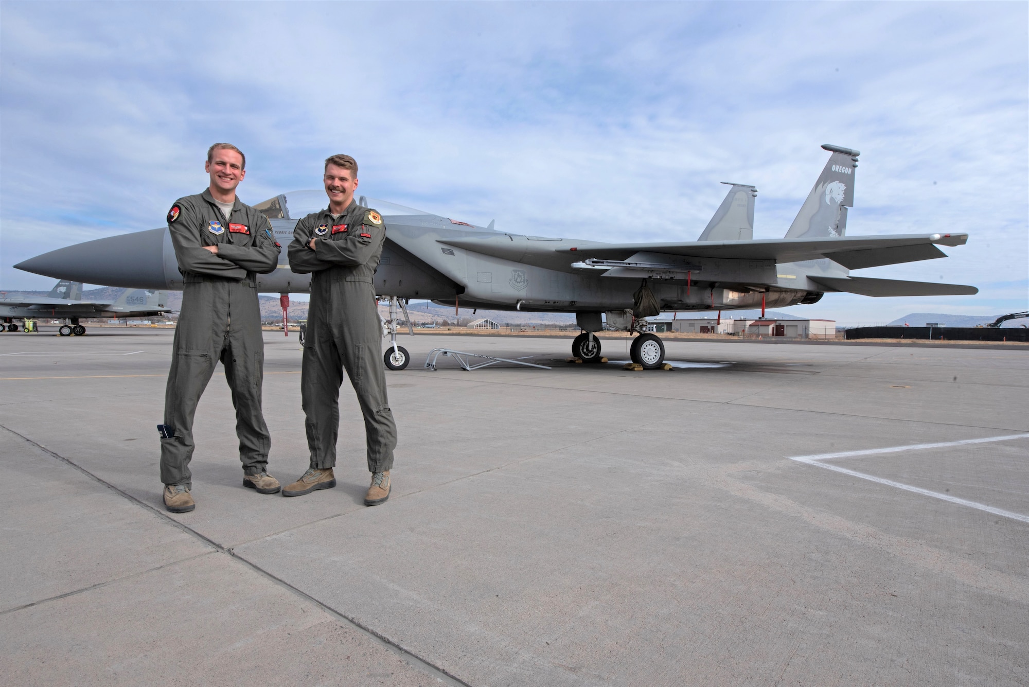 U.S. Air Force Capt. Jasper (left) and 1st Lt. David Arneberg are brothers who for the first time in 173rd Fighter Wing history are navigating the F-15C B-Course together, Nov. 12, 2020 at Kingsley Field in Klamath Falls, Oregon. Although both completed Undergraduate Pilot Training and Introduction to Fighter Fundamentals in separate locations, their paths converged when both tracked to F-15C aircraft at the sole schoolhouse for the Eagle in the U.S. Air Force. (U.S. Air National Guard photo by Master Sgt. Jefferson Thompson)
