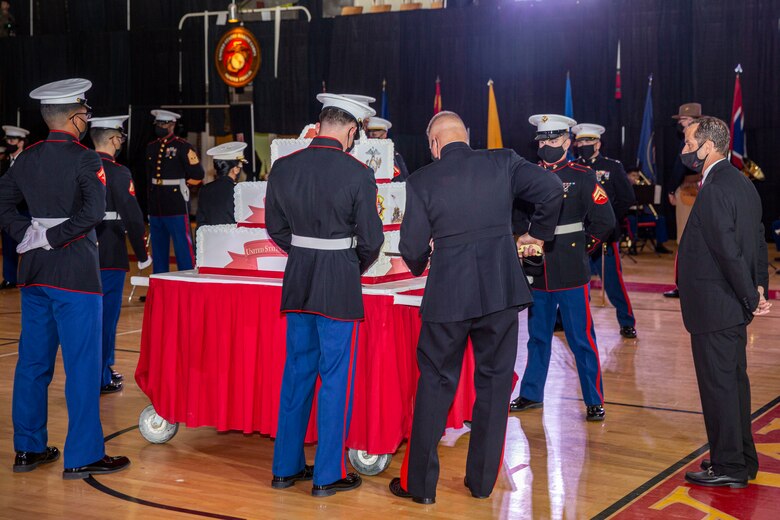 U.S. Marine Corps Maj. Gen. Julian D. Alford, commanding general, Marine Corps Installations East-Marine Corps Base Camp Lejeune, cuts the traditional birthday cake during the MCIEAST-MCB Camp Lejeune cake cutting ceremony at the Goettge Memorial Field House on MCB Camp Lejeune, North Carolina, Nov. 10, 2020. Marines with MCIEAST-MCB Camp Lejeune celebrated the 245th Marine Corps birthday by reading the birthday message from Gen. John A. Lejeune, 13th Commandant of the Marine Corps and cutting the traditional birthday cake while adhering to COVID-19 mitigation protocols. (U.S. Marine Corps photo by Lance Cpl. Christian Ayers)