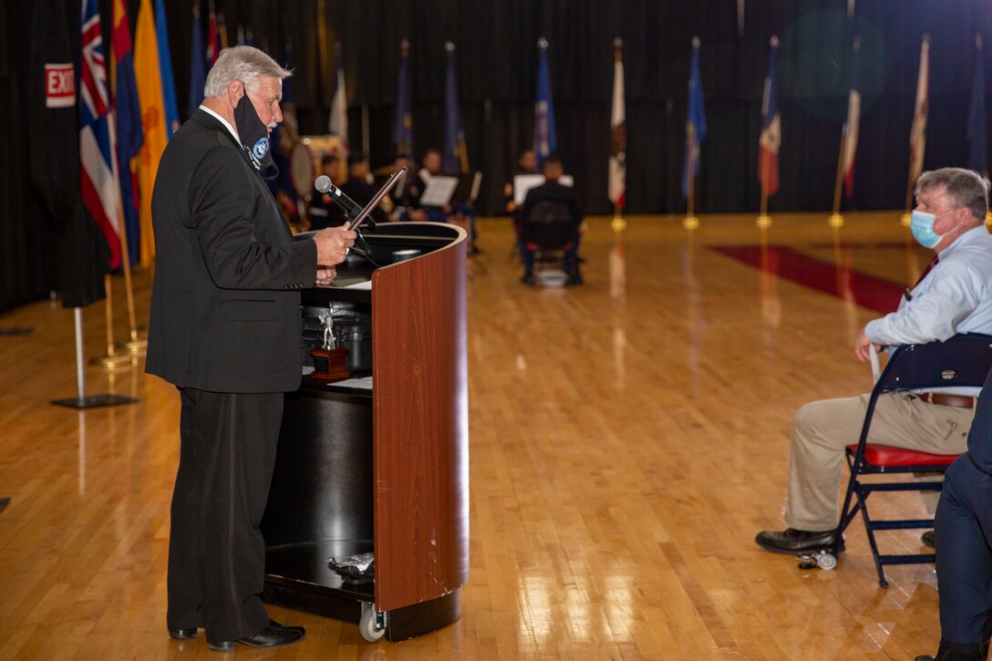 Jack Bright, a member of the Onslow County Board of Commissioners, gives a speech during the Marine Corps Installations East-Marine Corps Base Camp Lejeune cake cutting ceremony at the Goettge Memorial Field House on MCB Camp Lejeune, North Carolina, Nov. 10, 2020. Marines with MCIEAST-MCB Camp Lejeune celebrated the 245th Marine Corps birthday by reading the birthday message from Gen. John A. Lejeune, 13th Commandant of the Marine Corps and cutting the traditional birthday cake while adhering to COVID-19 mitigation protocols. (U.S. Marine Corps photo by Lance Cpl. Christian Ayers)