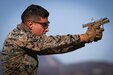 A U.S. Marine fires his M18 modular handgun at targets during a Marine Corps Marksmanship Competition team match at Edson Range on Camp Pendleton, Calif., Nov. 10.